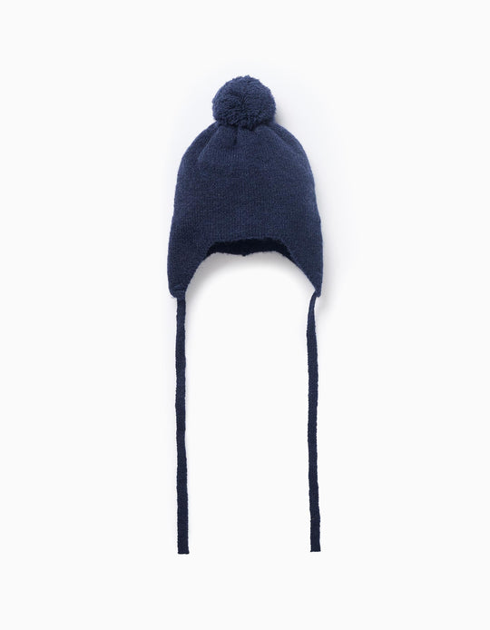 Knitted beanie with side straps and pompom for newborn boys, blue